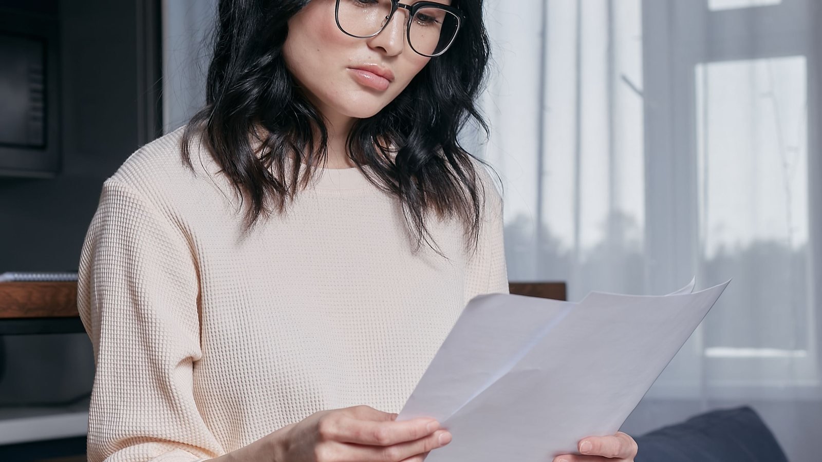 Applicant carefully comparing and reviewing qualification documents.
